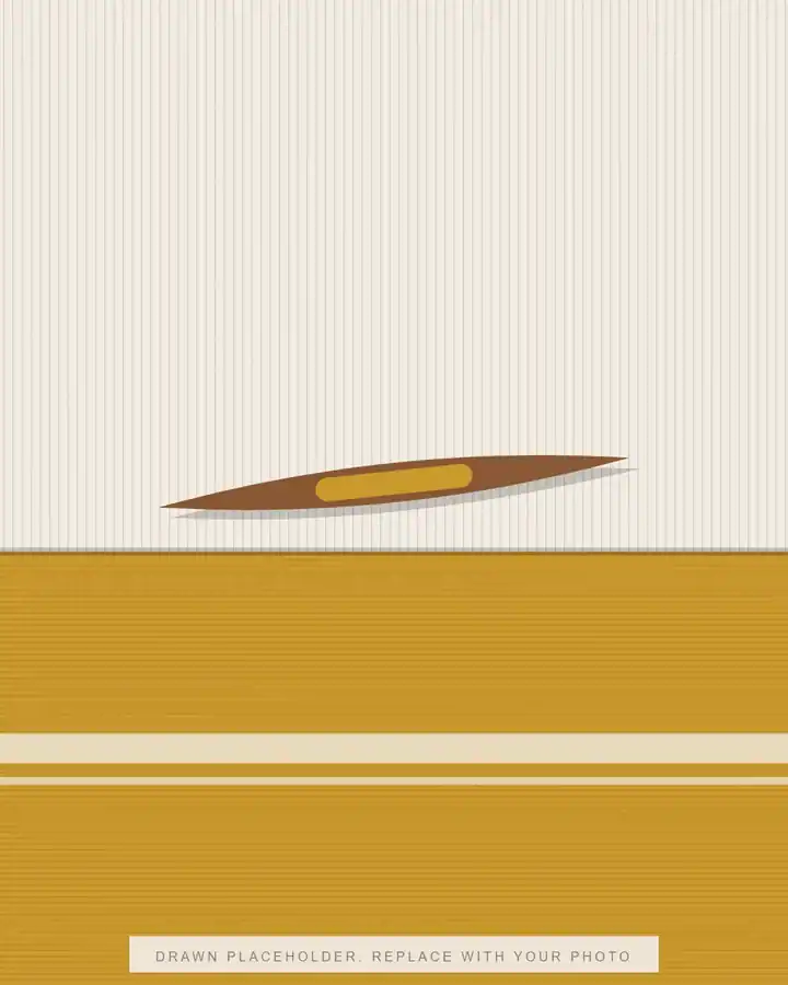 A wooden shuttle lying across threads on a hand loom, with mustard cloth below